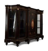 A Napoleon III Gilt Bronze and Porcelain Mounted Ebony and Marquetry Cabinet — CIRCA 1870