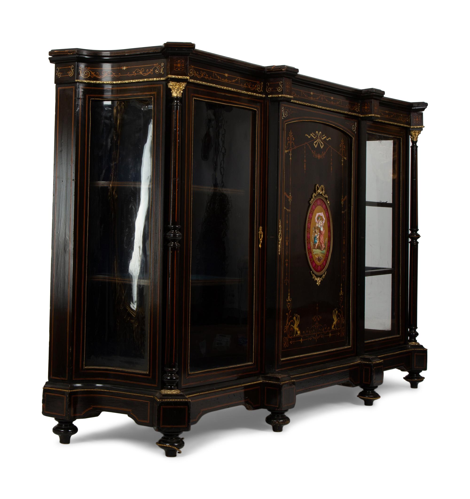 A Napoleon III Gilt Bronze and Porcelain Mounted Ebony and Marquetry Cabinet — CIRCA 1870