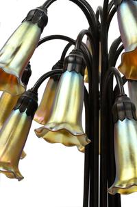 A Pair of Art Nouveau Style Patinated Metal and Iridescent Glass Eighteen-Light Tulip Lamps
