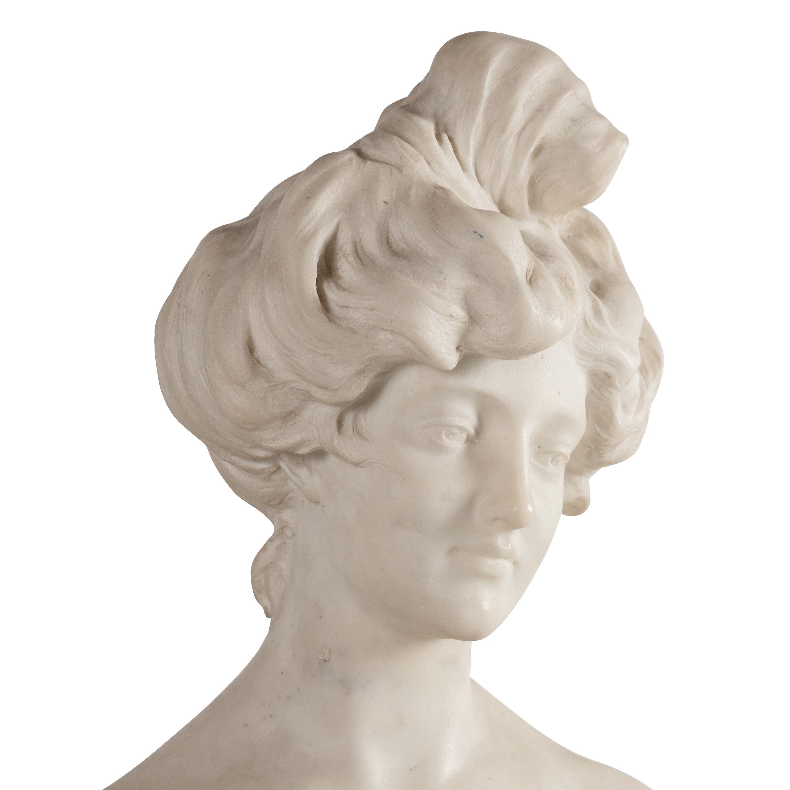An Italian Carved Marble Bust of a Young Woman