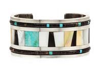 A Silver, Mother-of-Pearl, Tortoise Shell and Turquoise Cuff Bracelet, 65.10 dwts.