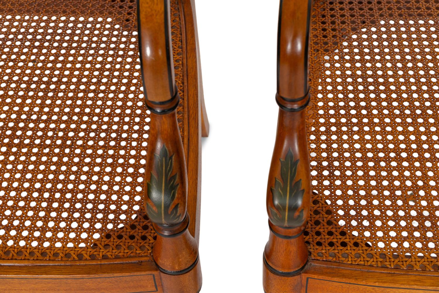 A Pair of Regency Style Paint Decorated and Parcel Ebonized Armchairs