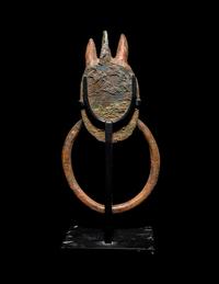 A Greek Bronze Handle with a Griffin Head