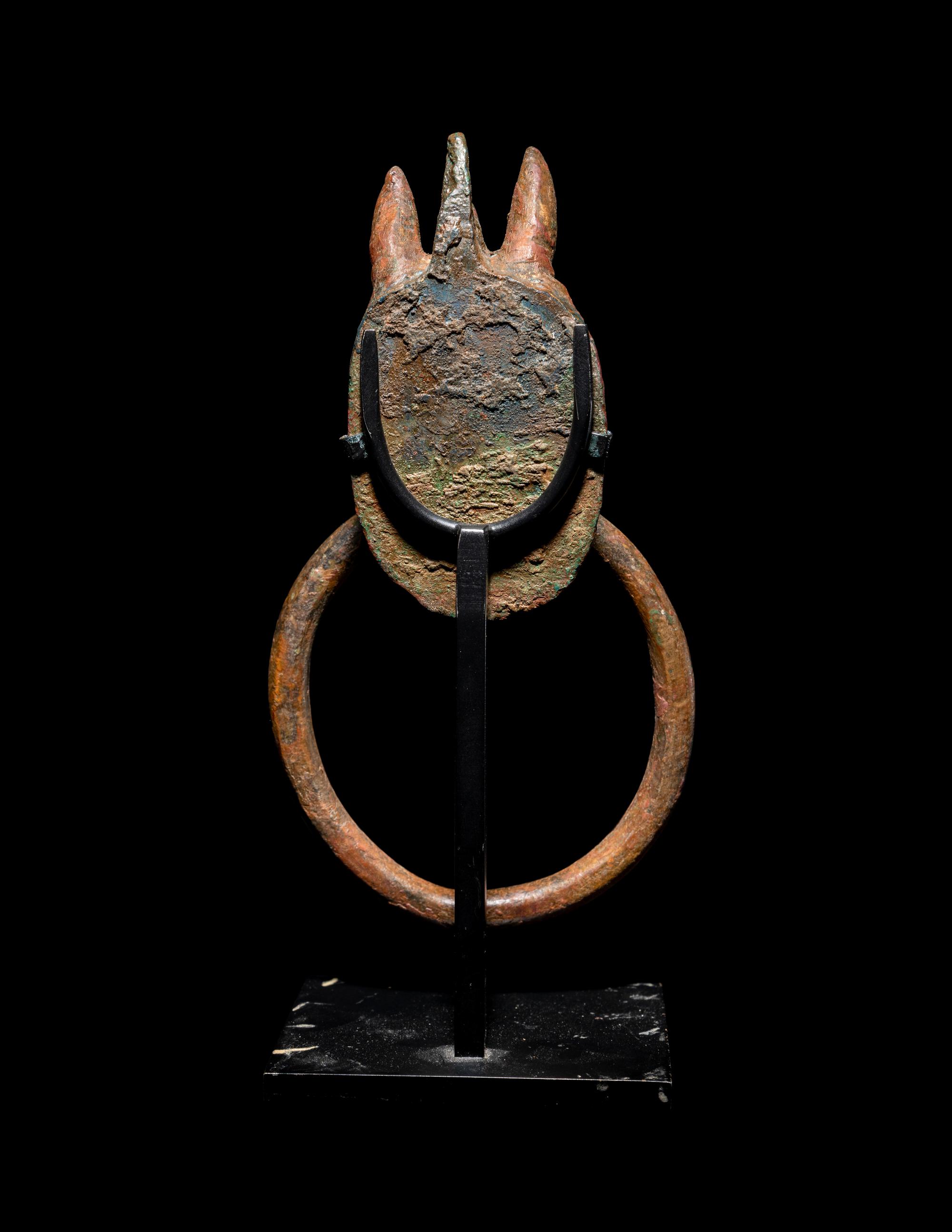 A Greek Bronze Handle with a Griffin Head