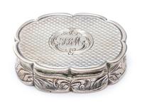 A Victorian Silver Vinaigrette, Edward Smith, Birmingham, 1857, of oval form with a scalloped rim, the sides worked with floral decorat