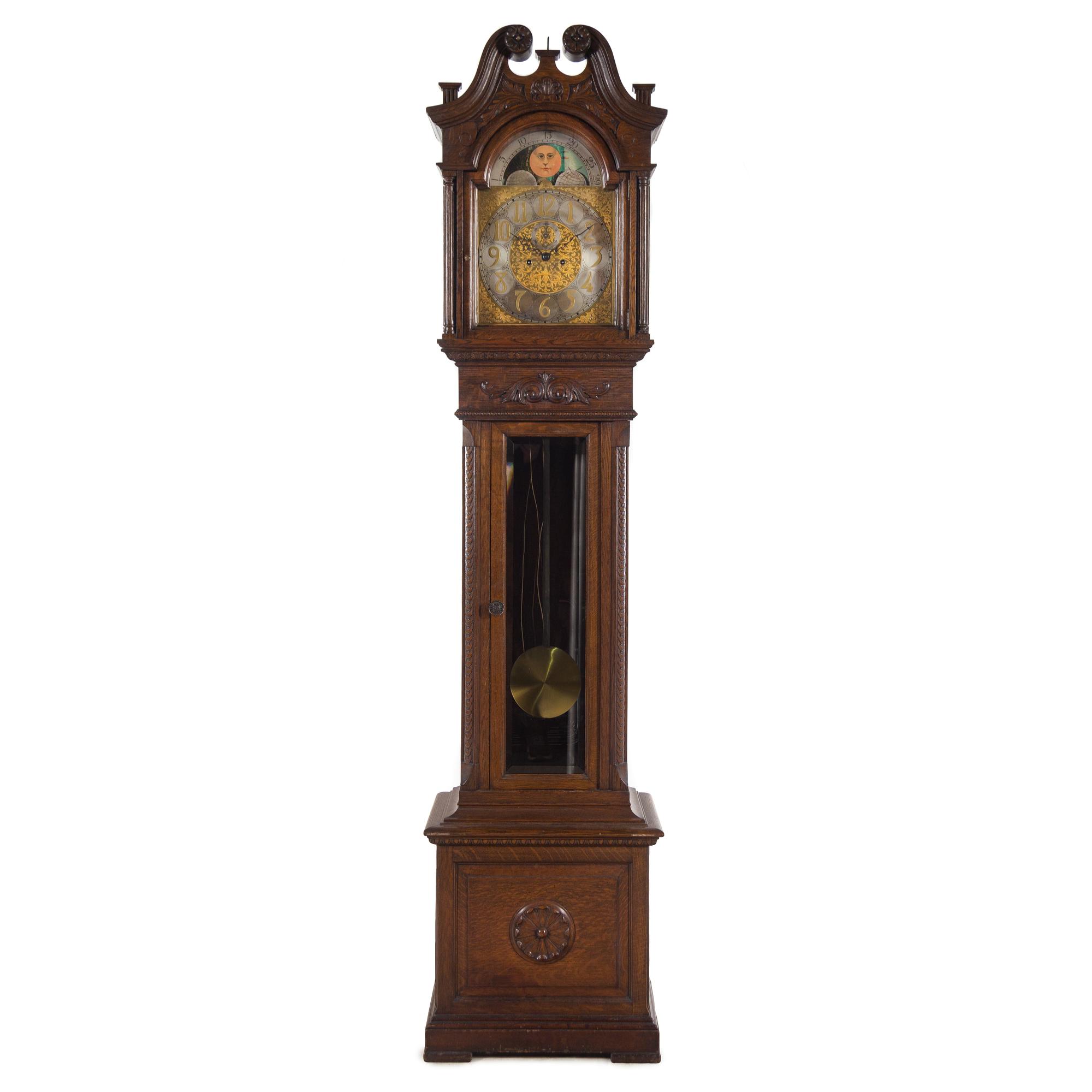 A Carved Oak Tall Case Clock