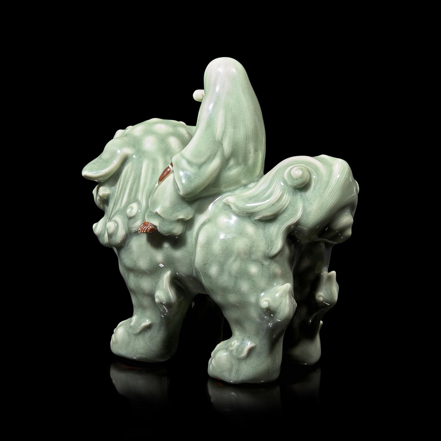 A Japanese Celadon-Glazed Monju on Lion, Impressed Seal Makuzu