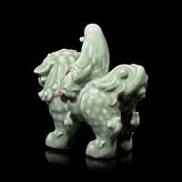 A Japanese Celadon-Glazed Monju on Lion, Impressed Seal Makuzu