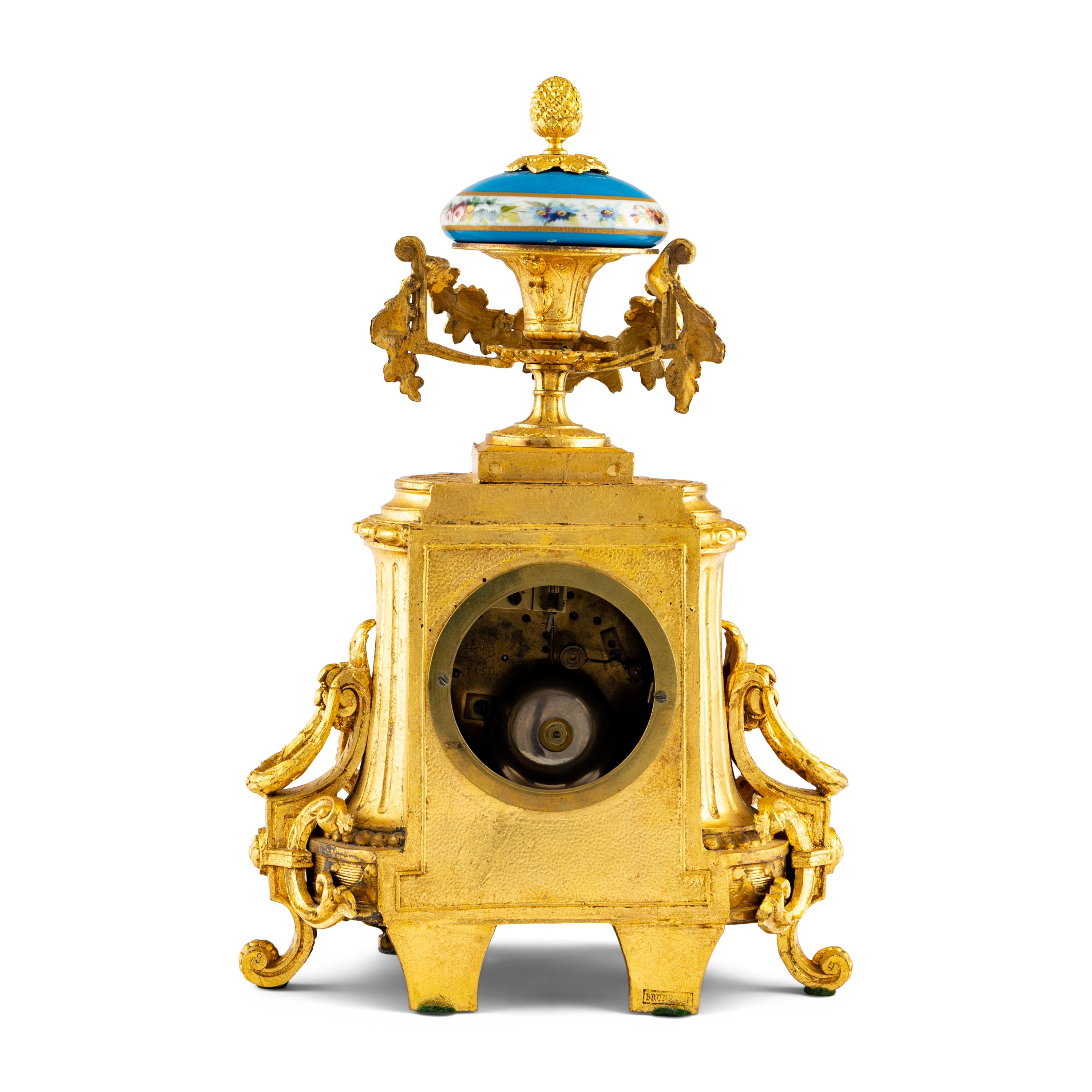A French Gilt-Metal and Porcelain-Inset Mantel Clock