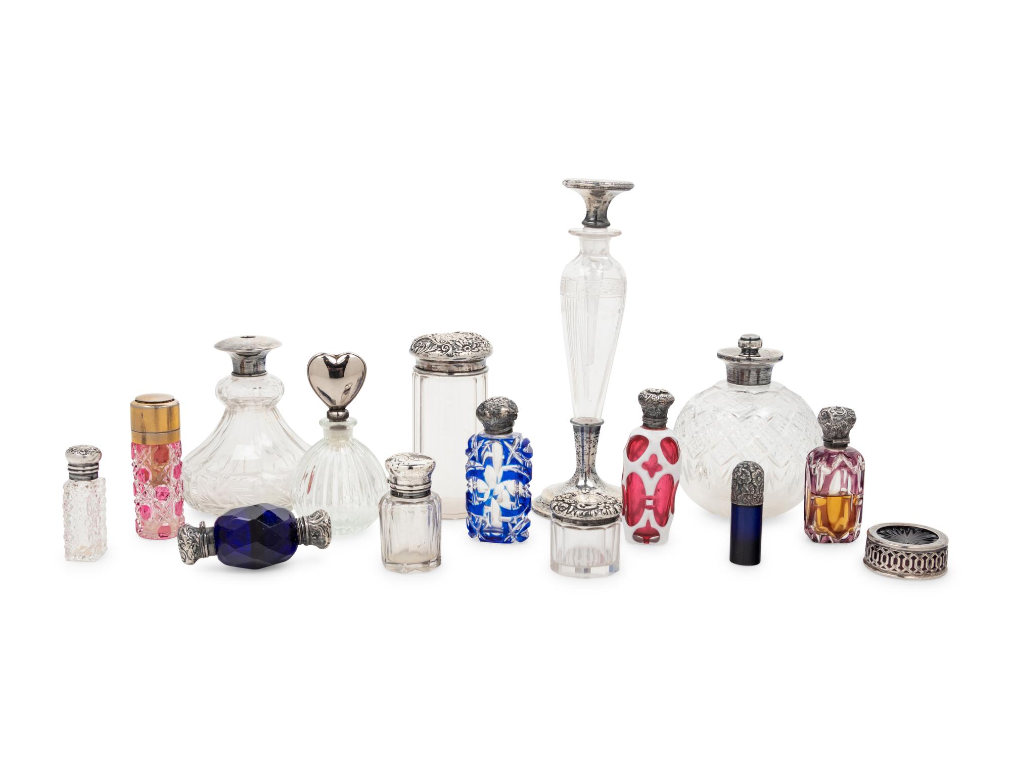 A Collection of Silver Mounted Glass Jars and Perfume Bottles