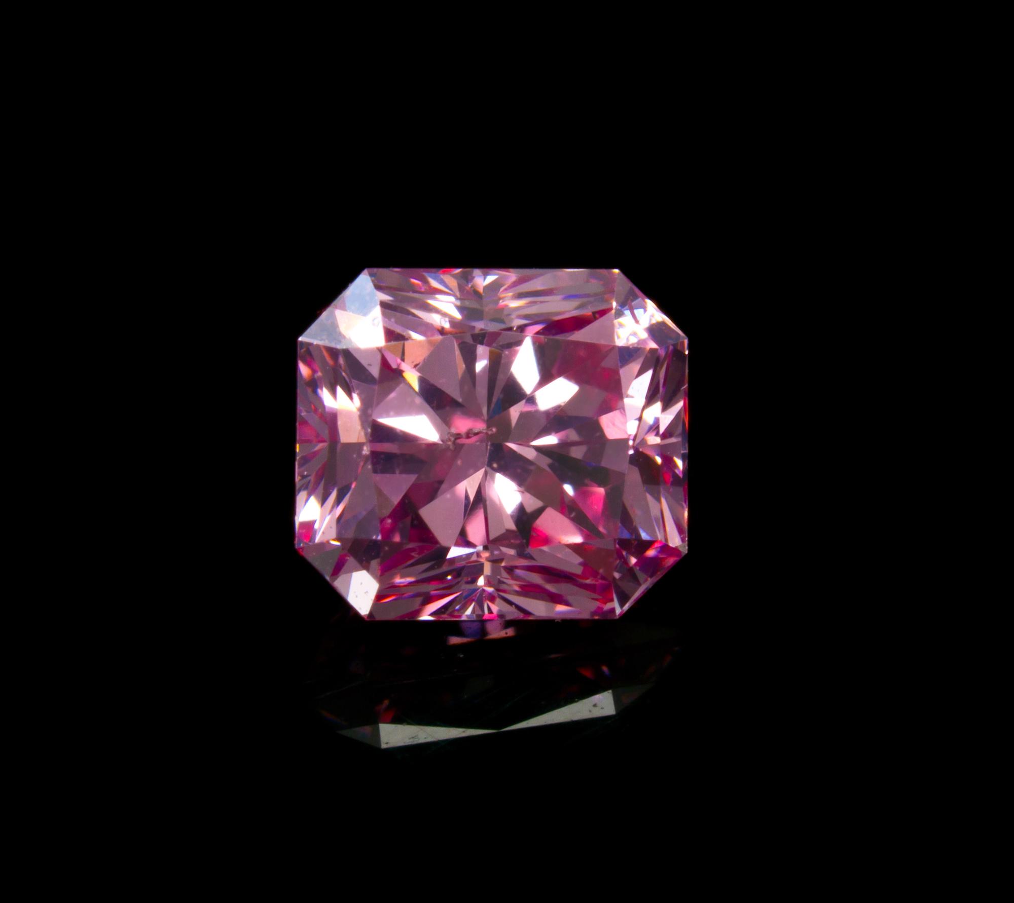 A 0.68 Carat Radiant Cut Fancy Intense Purplish Pink Diamond,