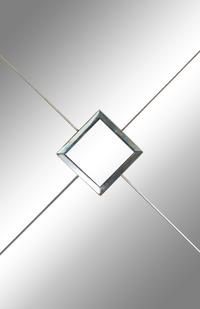 A Modernist Mirrored Four-Panel Floor Screen