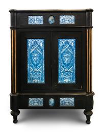 A Continental Blue Faience-Mounted Ebonized Cabinet
