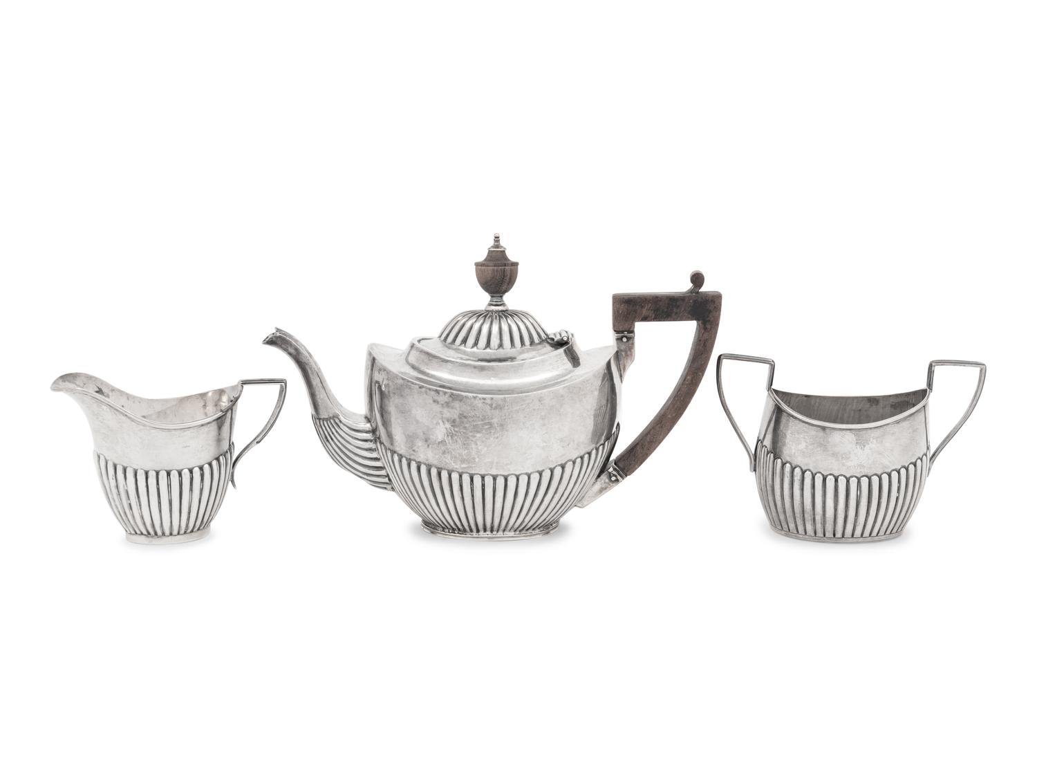 An Assembled Edwardian Silver Three-Piece Bachelor's Tea Service
