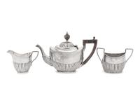 An Assembled Edwardian Silver Three-Piece Bachelor's Tea Service