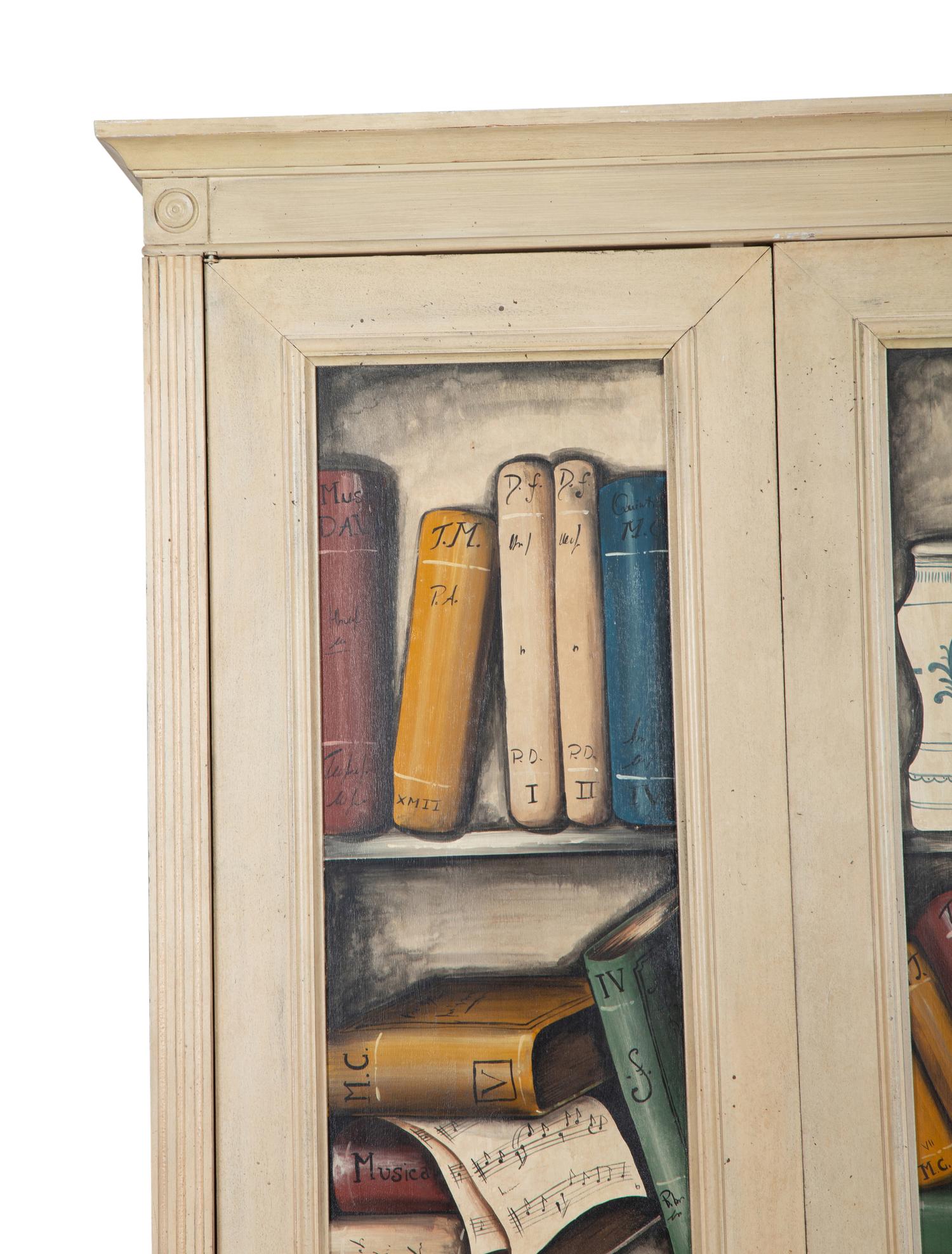 An Italian Painted Armoire with Book Decoration to the Doors