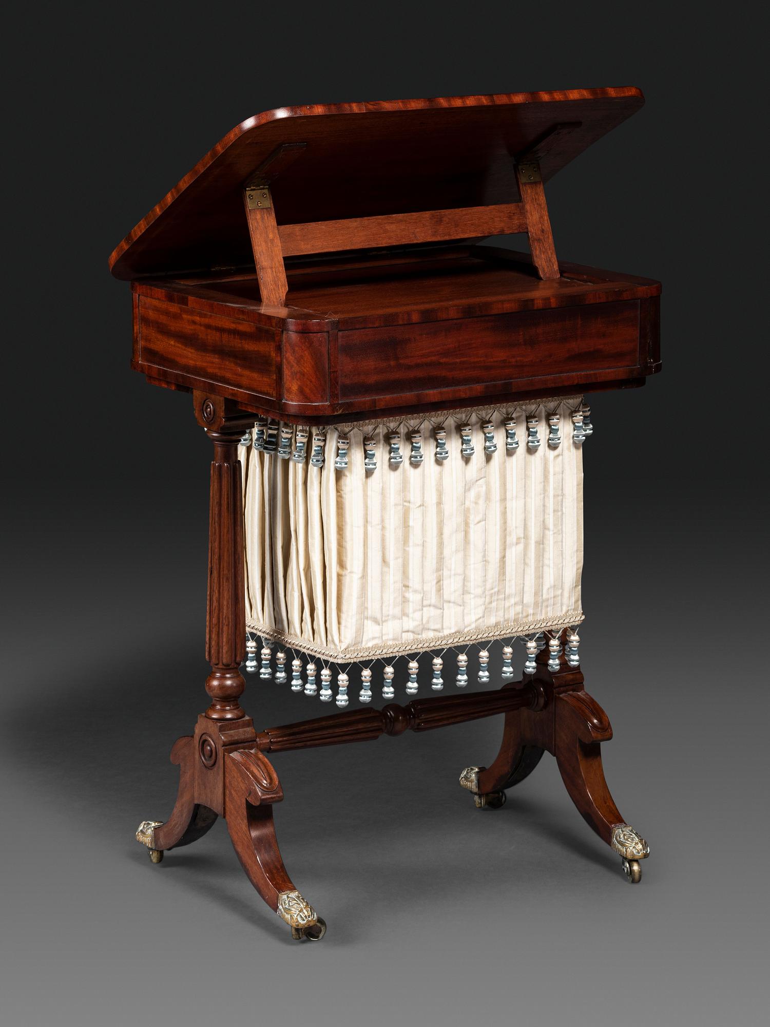 A Classical Figured Mahogany and Rosewood Veneered Sewing Table