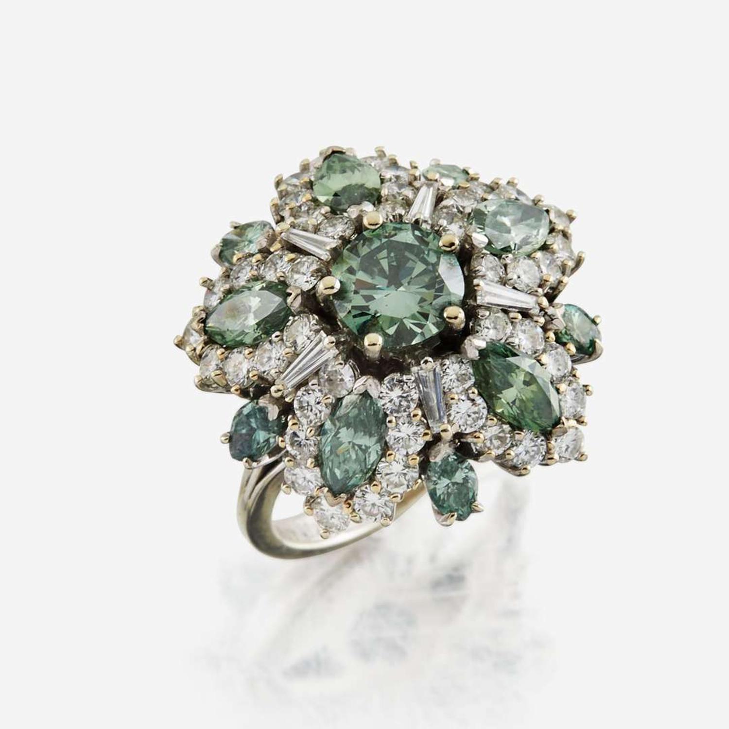 An irradiated green diamond, diamond, and white gold cocktail ring