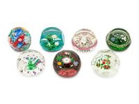 A Group of Seven Millefiori Glass Paperweights
