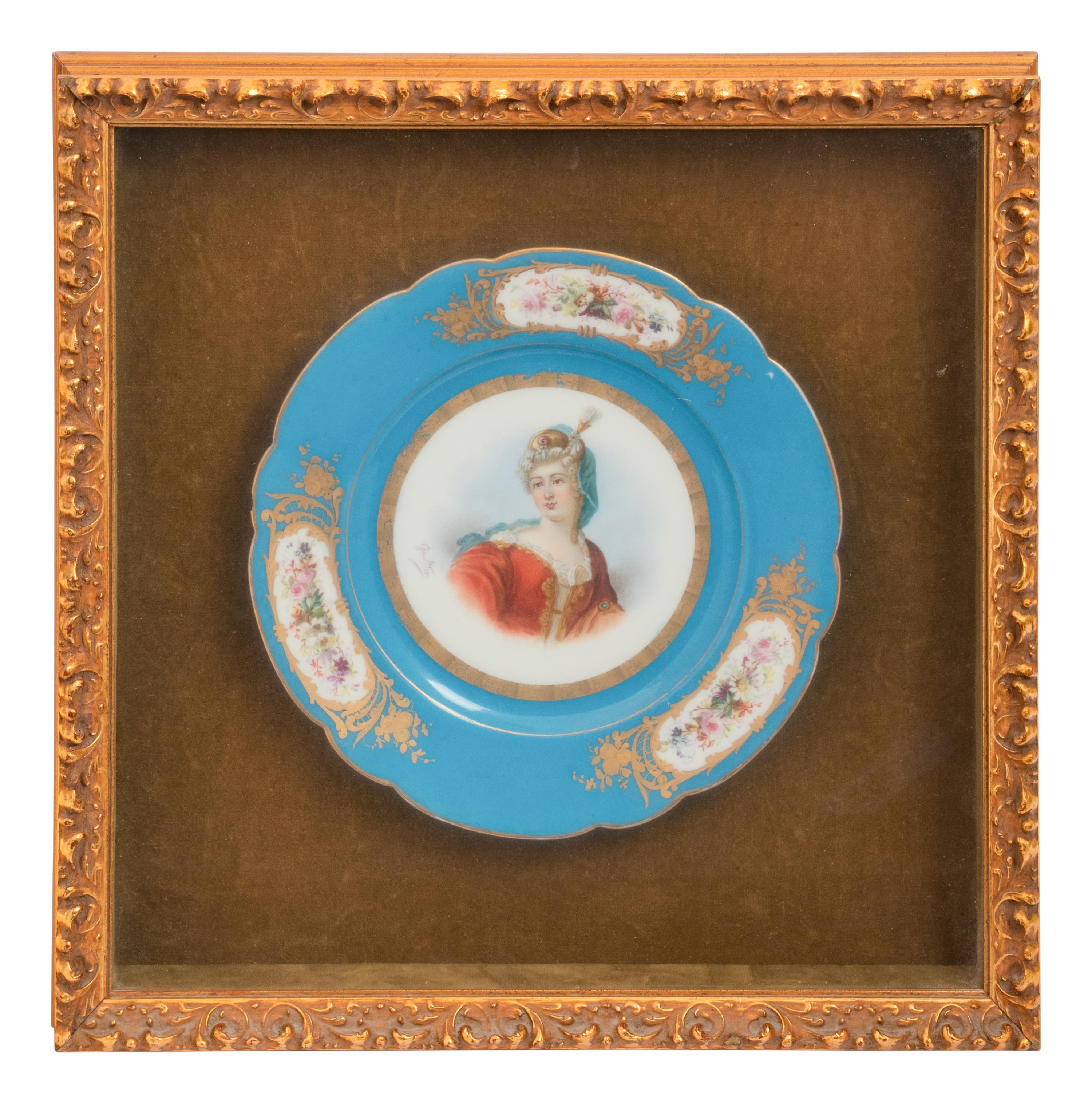 A Group of Seven Framed Sèvres Style Porcelain Plates