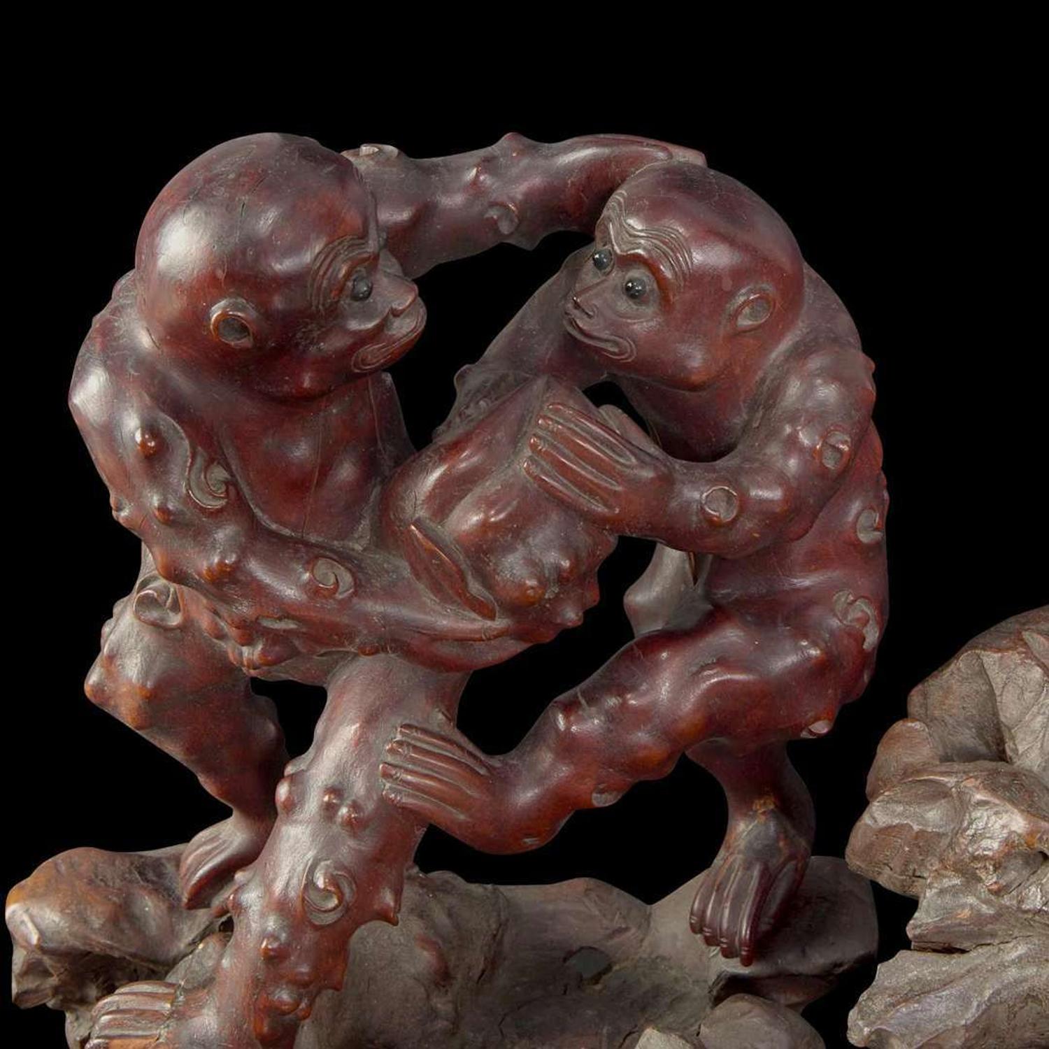 A large Chinese carved rootwood figural group depicting a meiren and monkeys 根雕美人与顽猴 Qing Dynasty ?
