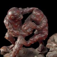 A large Chinese carved rootwood figural group depicting a meiren and monkeys 根雕美人与顽猴 Qing Dynasty ?