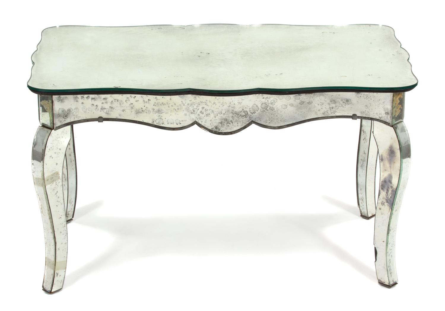 A Mirrored Coffee Table Height 18 1/2 x width 31 1/2 x depth 17 3/4 inches. — 20TH CENTURY