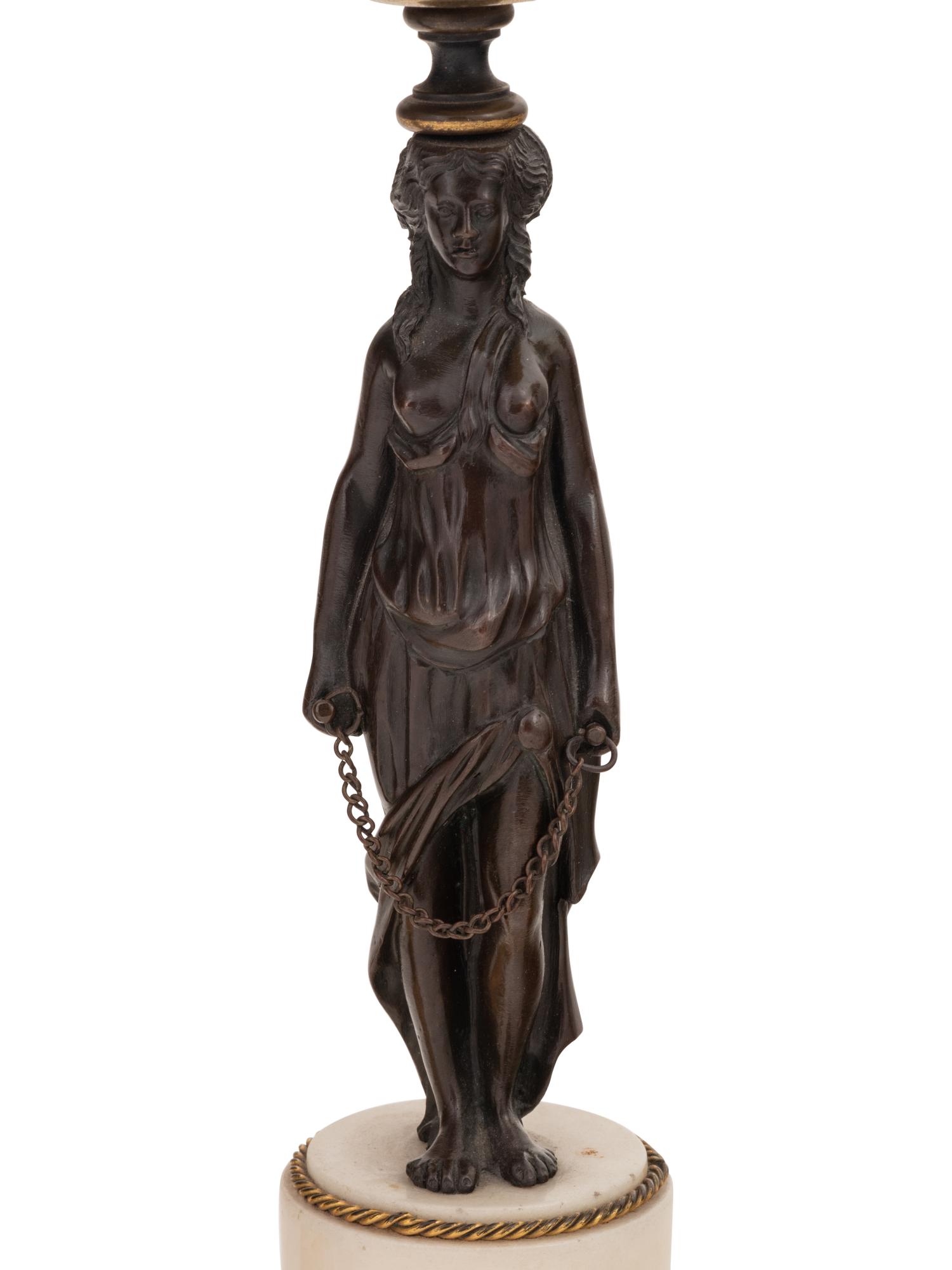 Two Pairs of French Gilt and Patinated Bronze Figural Candlesticks