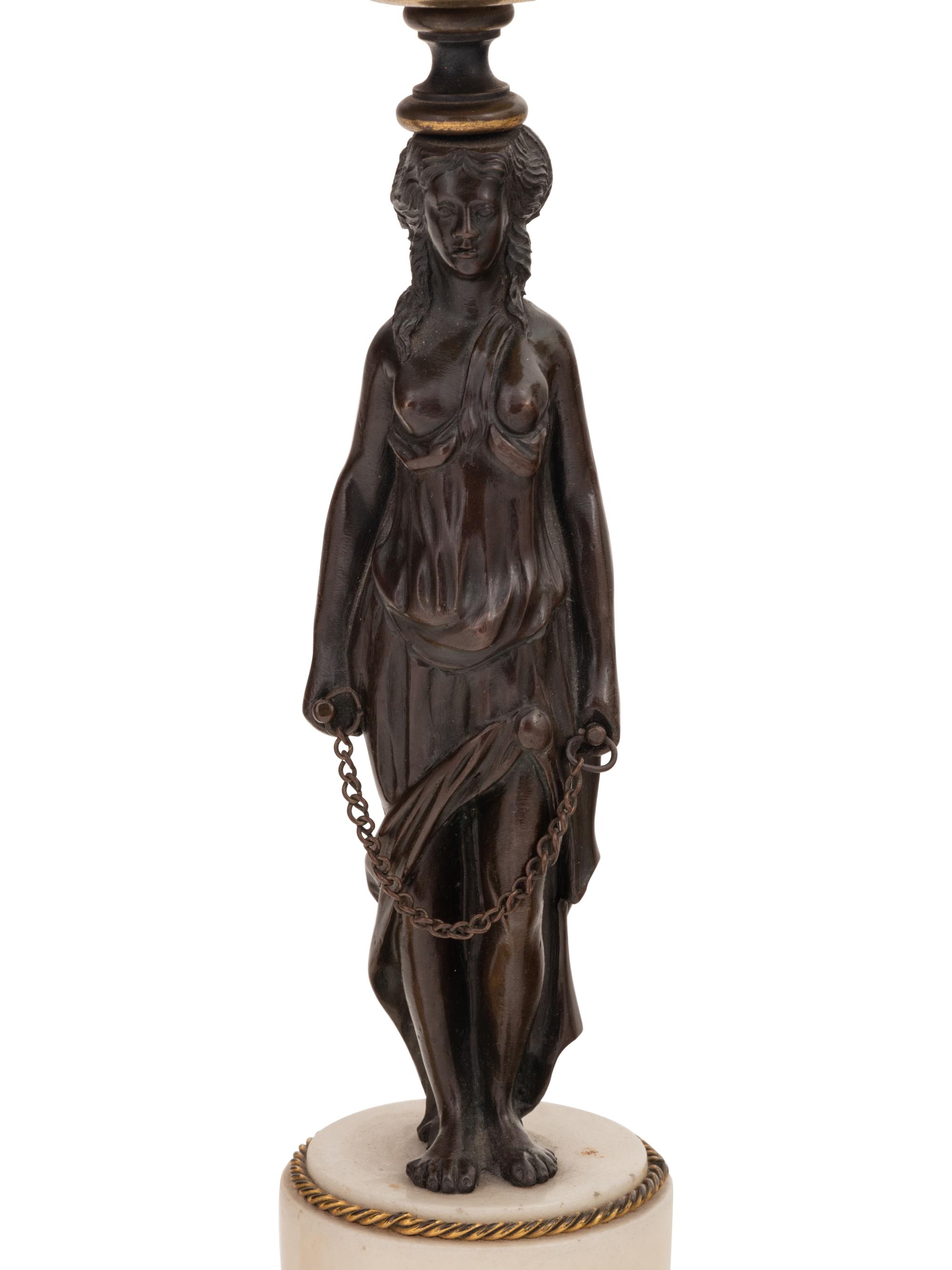 Two Pairs of French Gilt and Patinated Bronze Figural Candlesticks