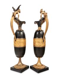 A Pair of Continental Gilt and Patinated Bronze Ewers