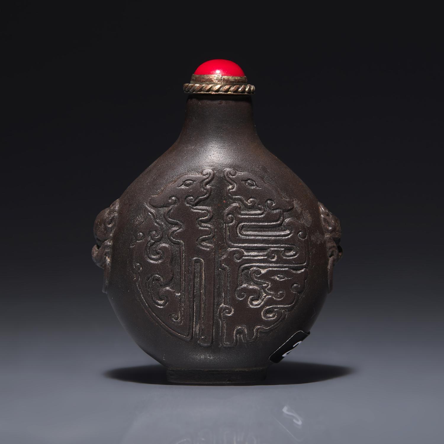 A Chinese Carved Duan Stone Snuff Bottle, Circa 1750-1820 1750-1820年 端石刻龍紋鼻烟壺