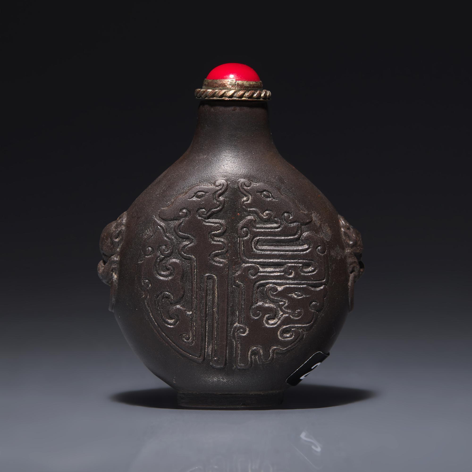 A Chinese Carved Duan Stone Snuff Bottle, Circa 1750-1820 1750-1820年 端石刻龍紋鼻烟壺