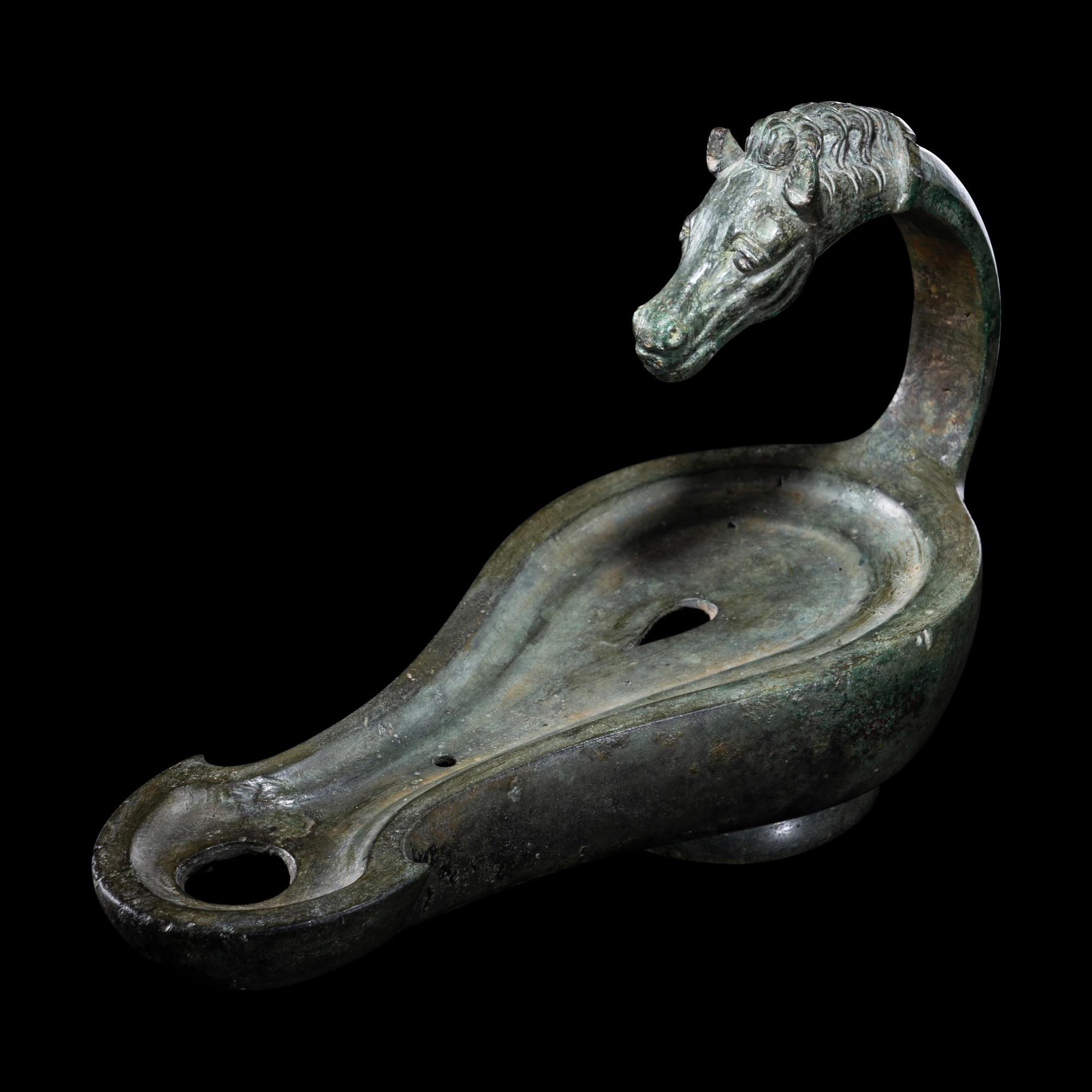 A Roman Bronze Horse Head Oil Lamp