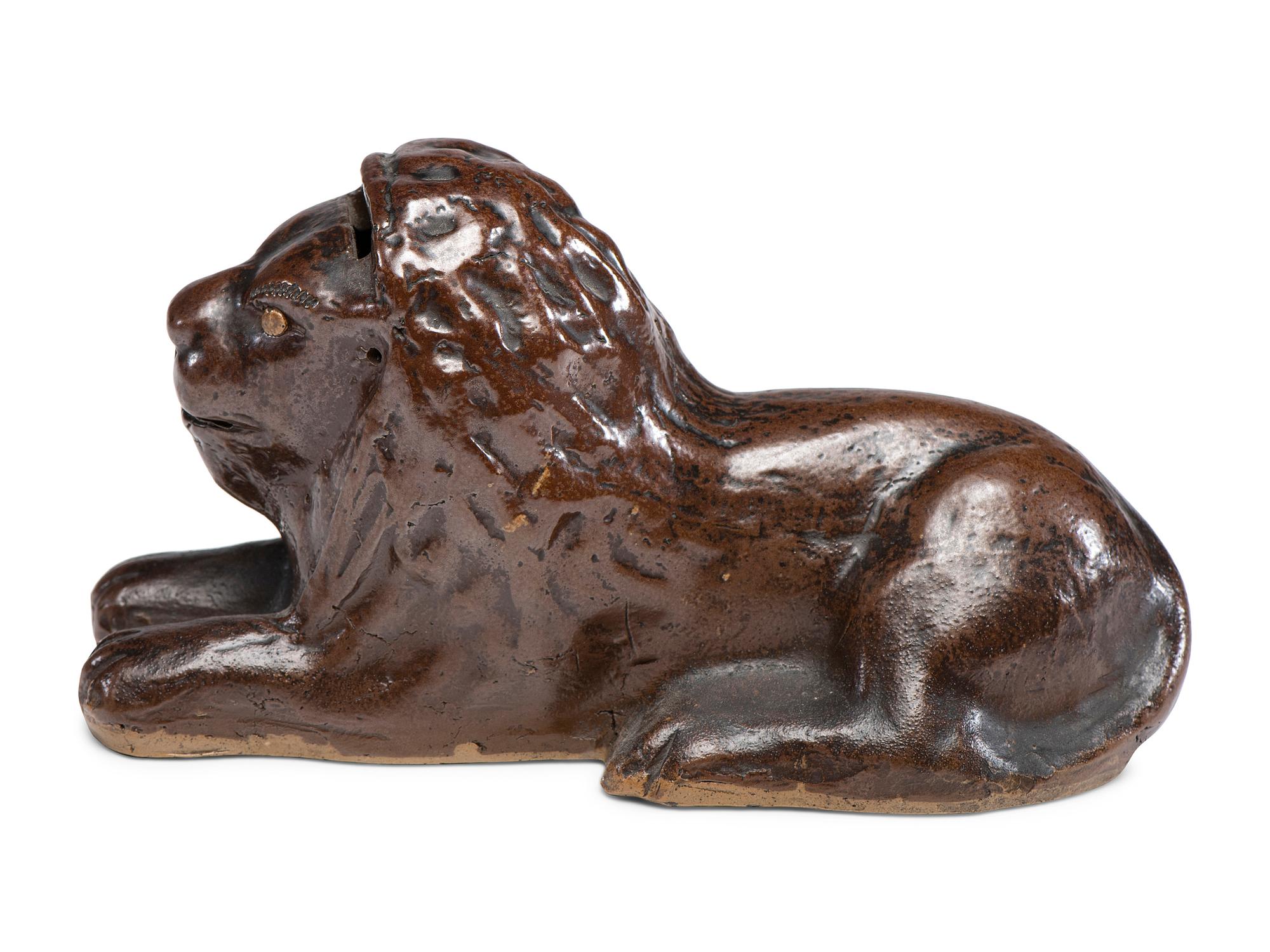 A Scarce Ohio Stoneware Recumbent Lion Bank