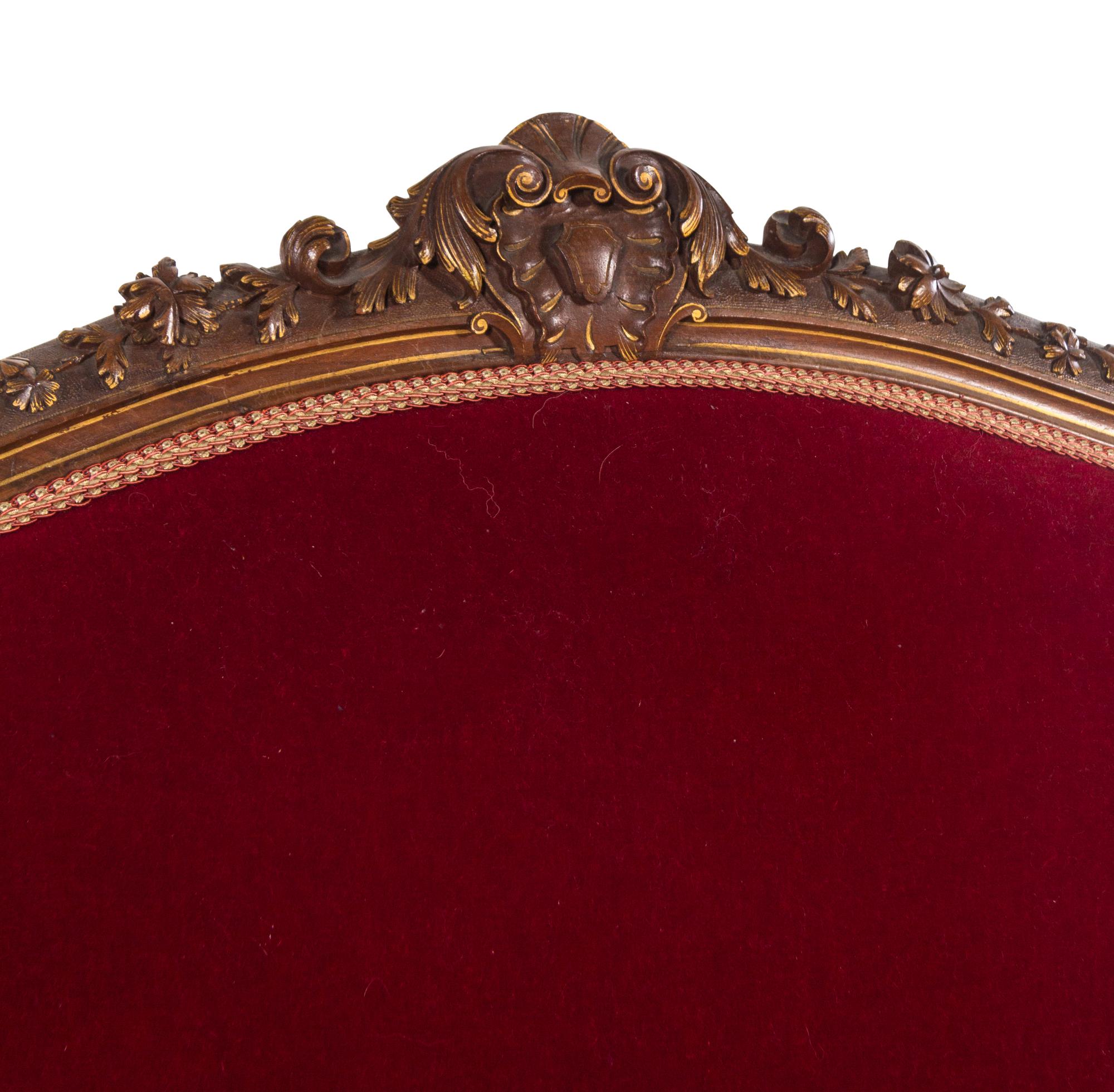 An Italian Louis XV Style Carved and Parcel Gilt Walnut Parlor Suite