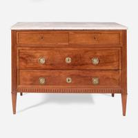 A French Directoire carved fruitwood commode with white marble top circa 1800