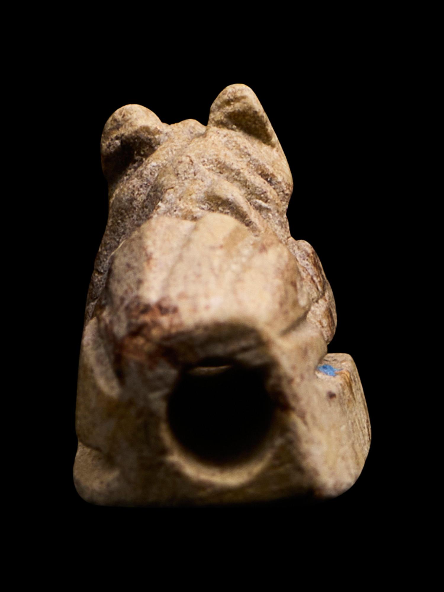 An Egyptian Faience Recumbent Animal