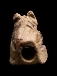 An Egyptian Faience Recumbent Animal