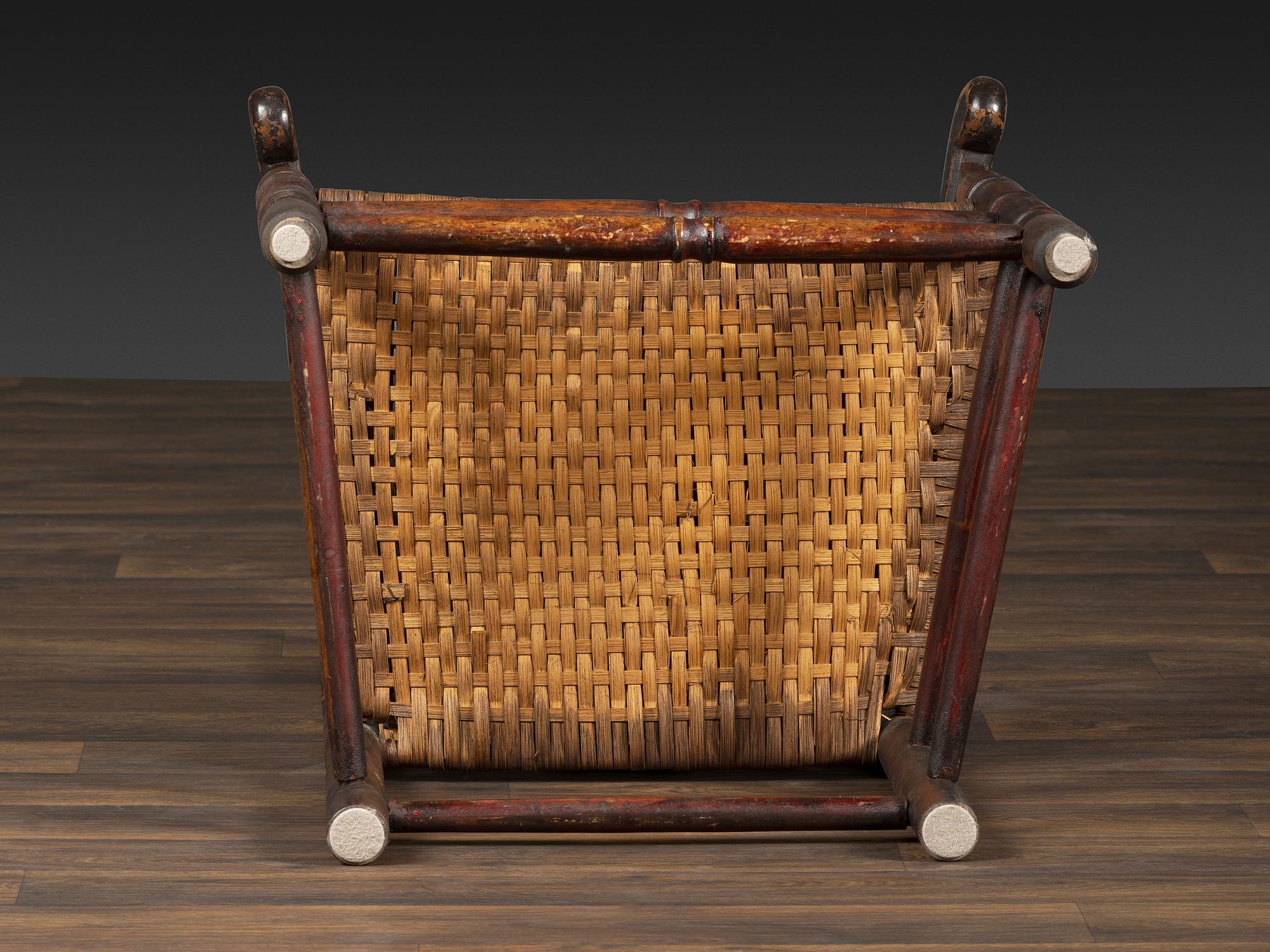 A William and Mary Style Parcel Gilt and Red Painted, Fan-Carved Bannister Back Woven Splint Seat Armchair