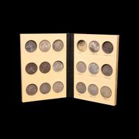 A Collection of Seventy Morgan Silver Dollars
