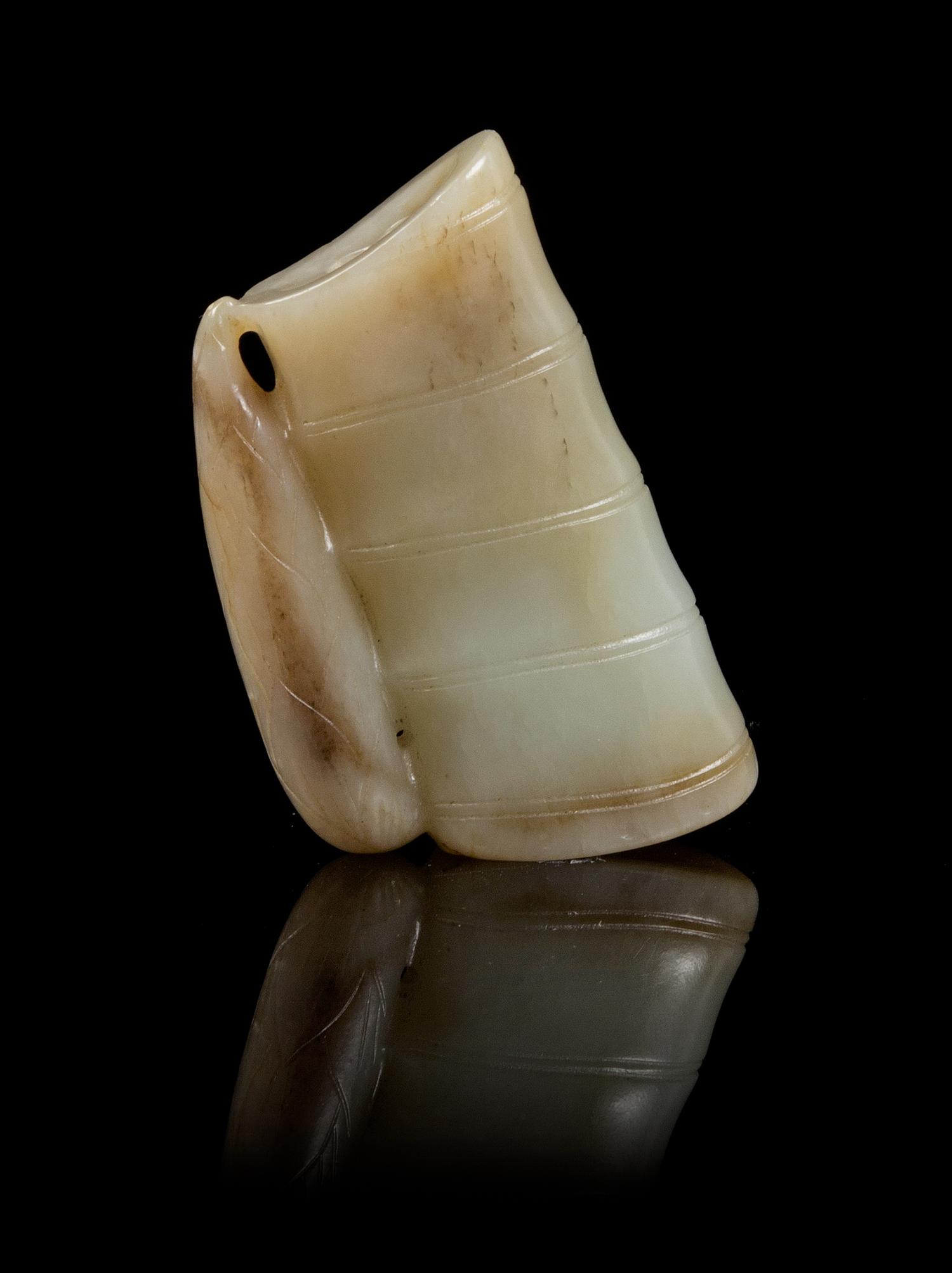 A Carved Jade Toggle Length 2 3/8 inches.