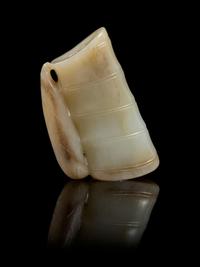 A Carved Jade Toggle Length 2 3/8 inches.