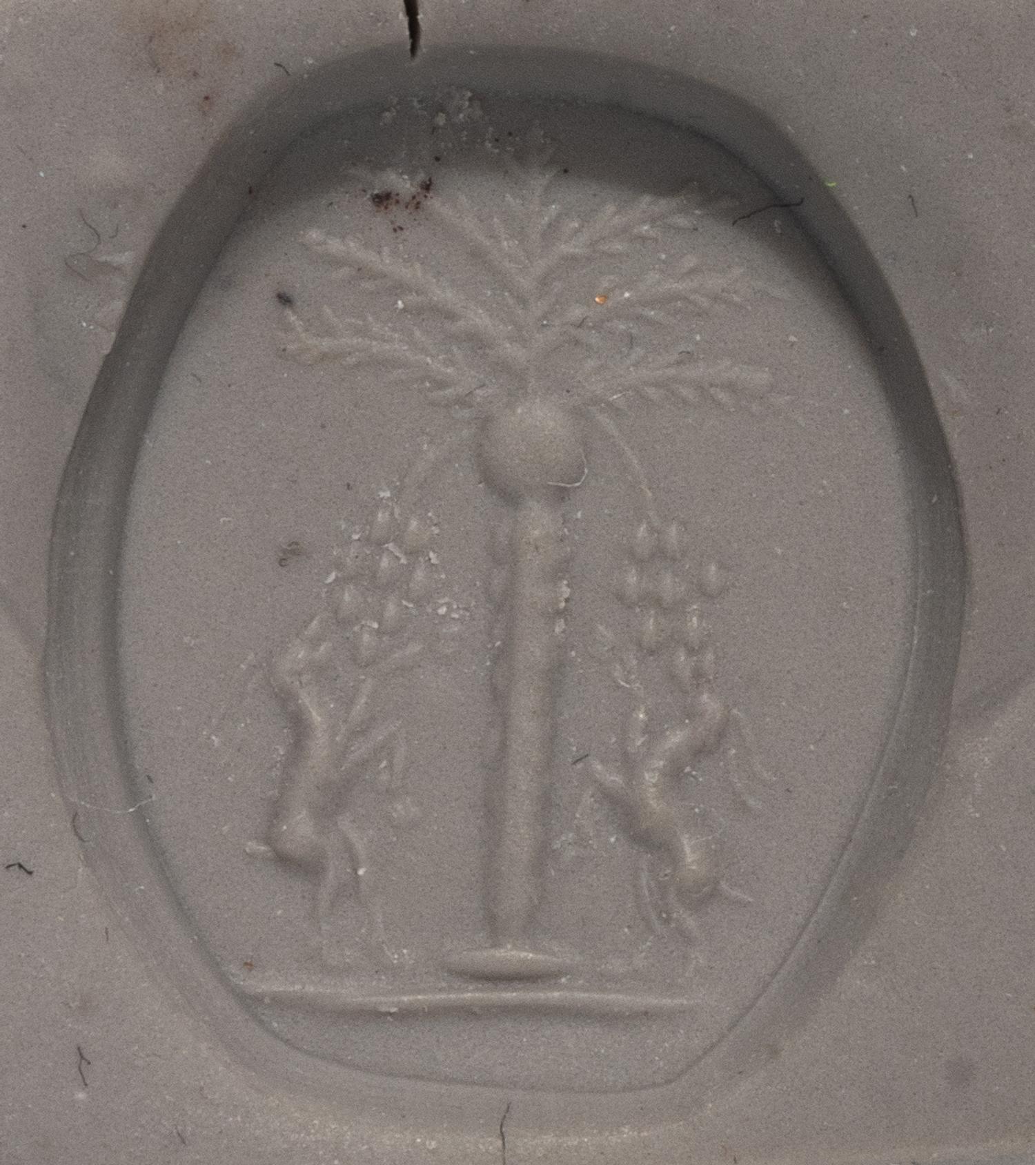 A Levantine Banded Agate Bead with Two Ibexes Feeding on a Date Tree
