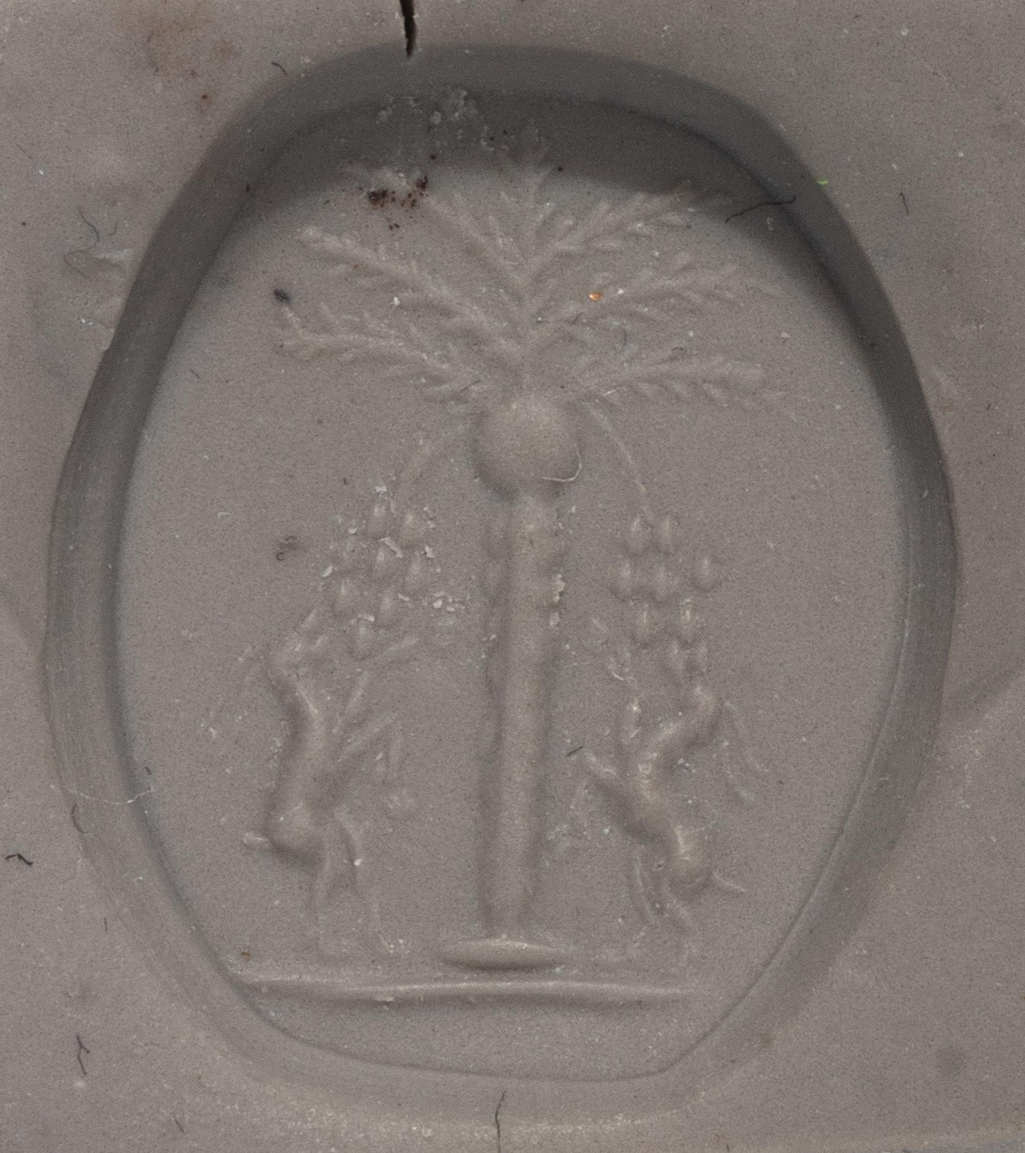 A Levantine Banded Agate Bead with Two Ibexes Feeding on a Date Tree
