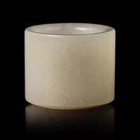 A Chinese Incised White Jade 'Poem' Archer's Ring, 18th/19th Century 清中晚期 白玉詩文扳指