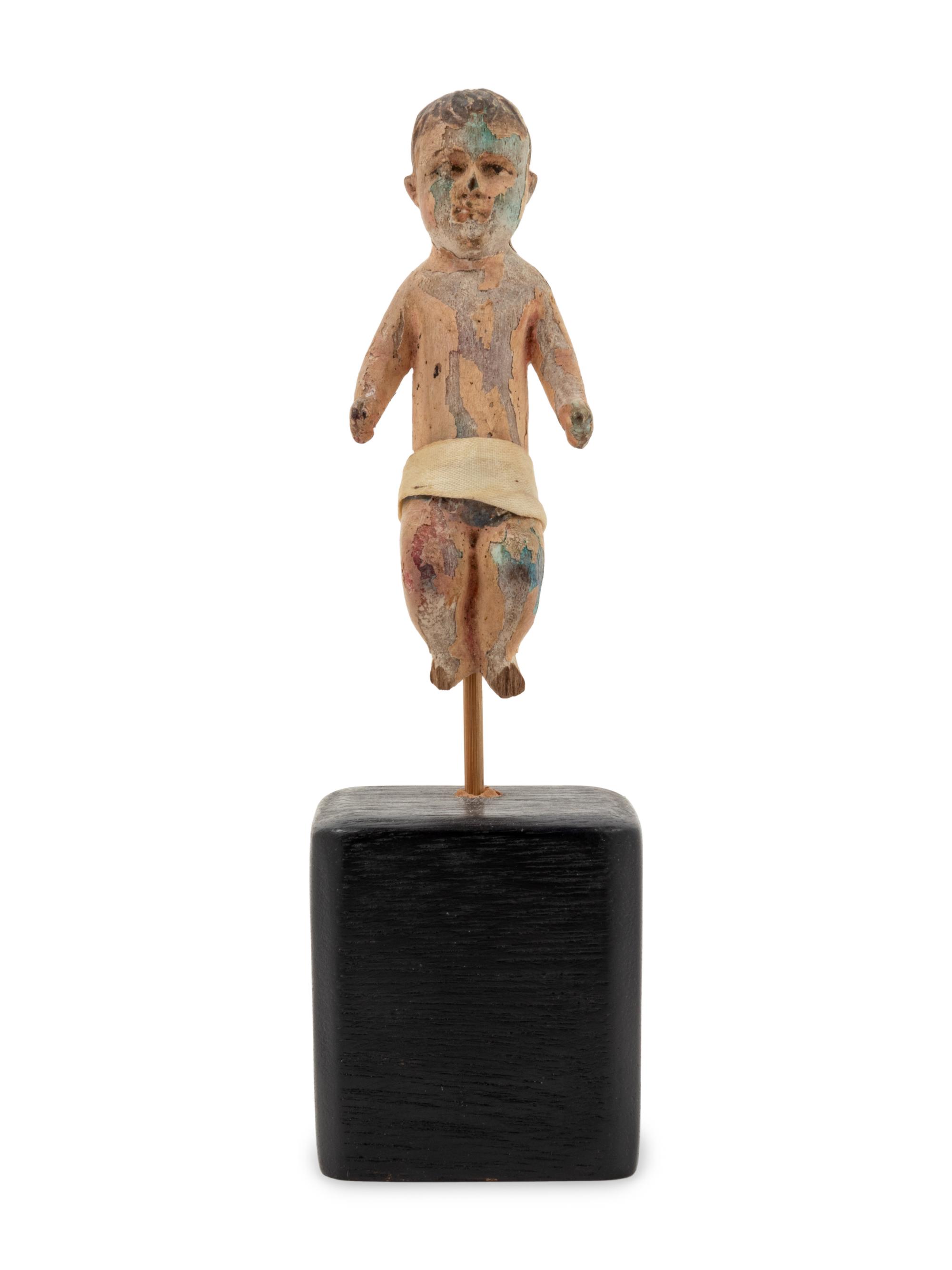 A Spanish Colonial Carved Wood Figure of the Christ Child
