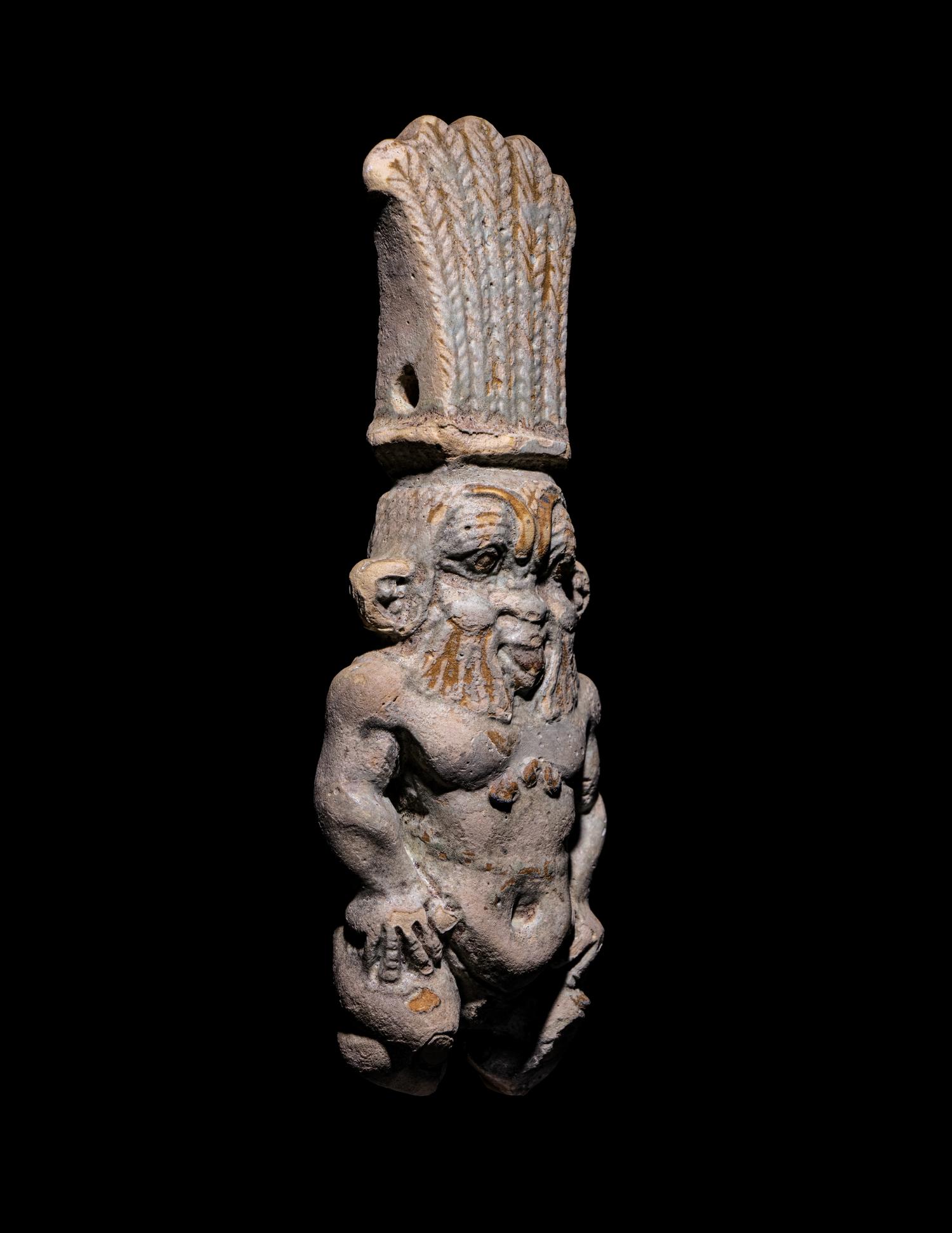 An Egyptian Bichrome Faience Double-Sided Bes