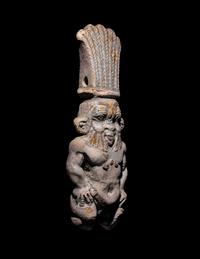 An Egyptian Bichrome Faience Double-Sided Bes