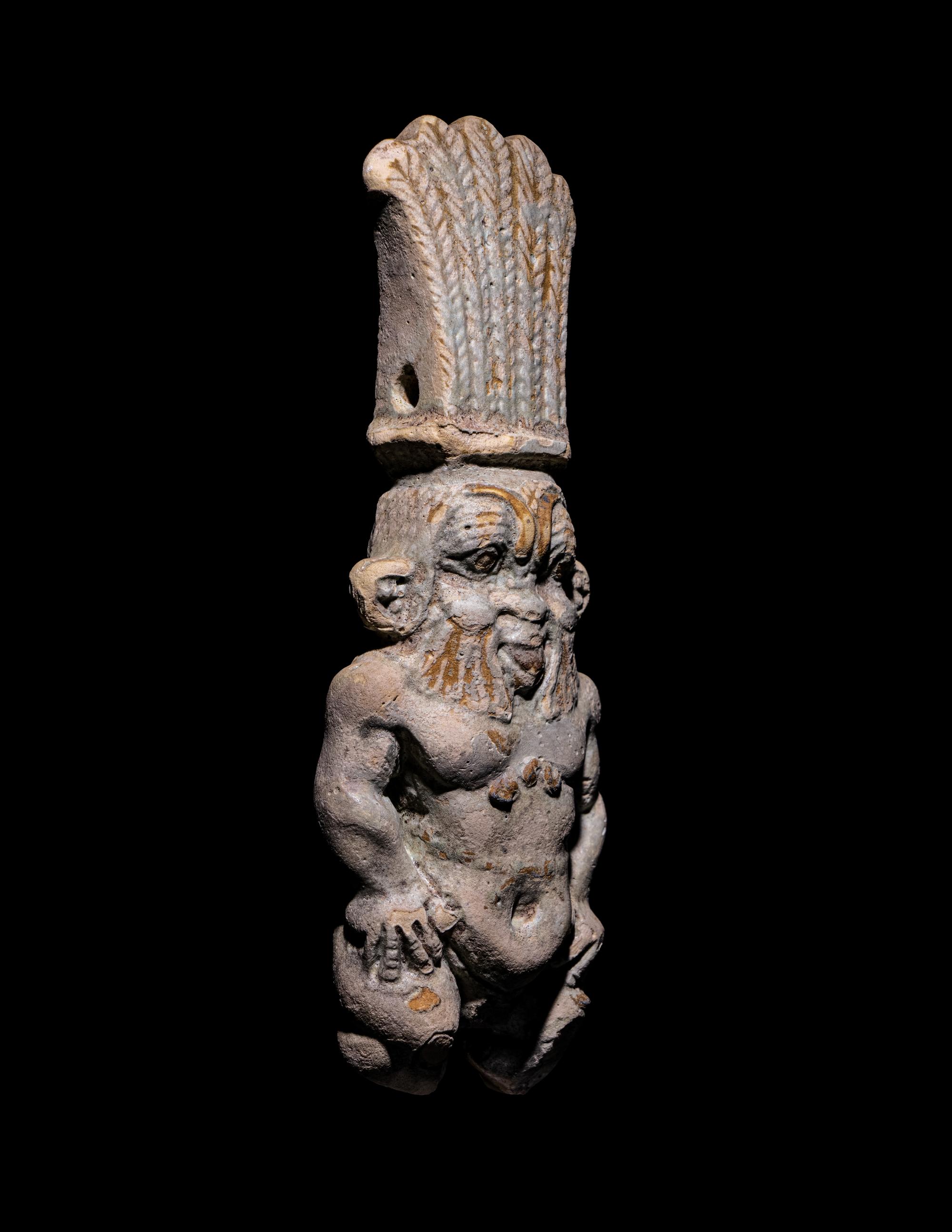 An Egyptian Bichrome Faience Double-Sided Bes