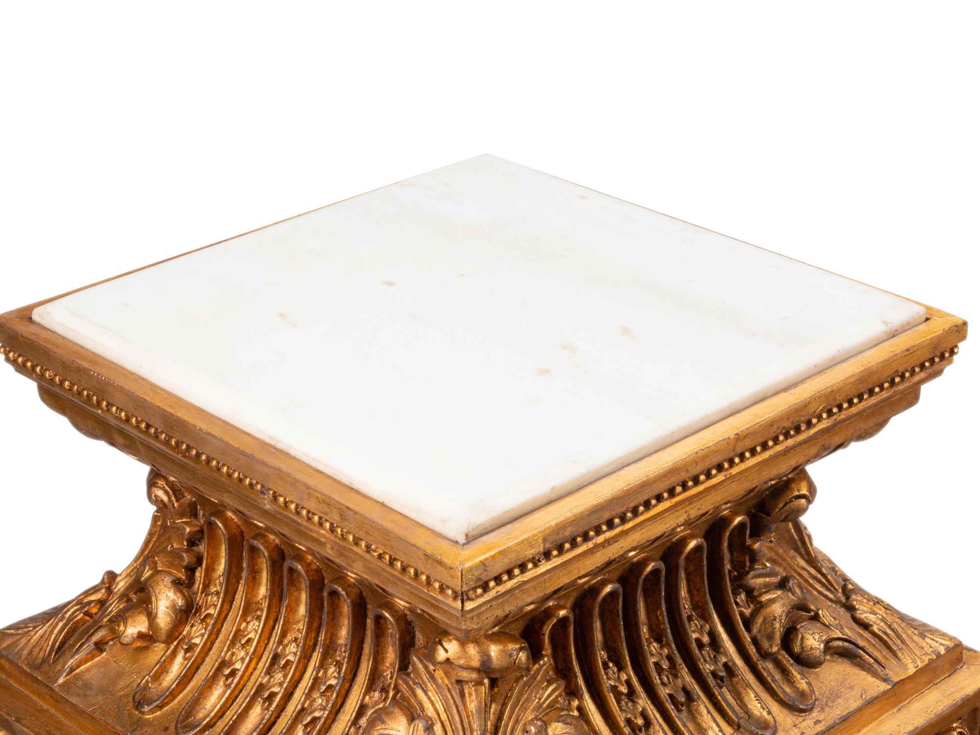 A Pair of Régence Style Giltwood Marble-Top Pedestals